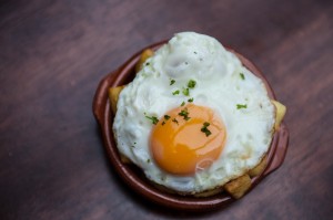 Patatas bravas with egg